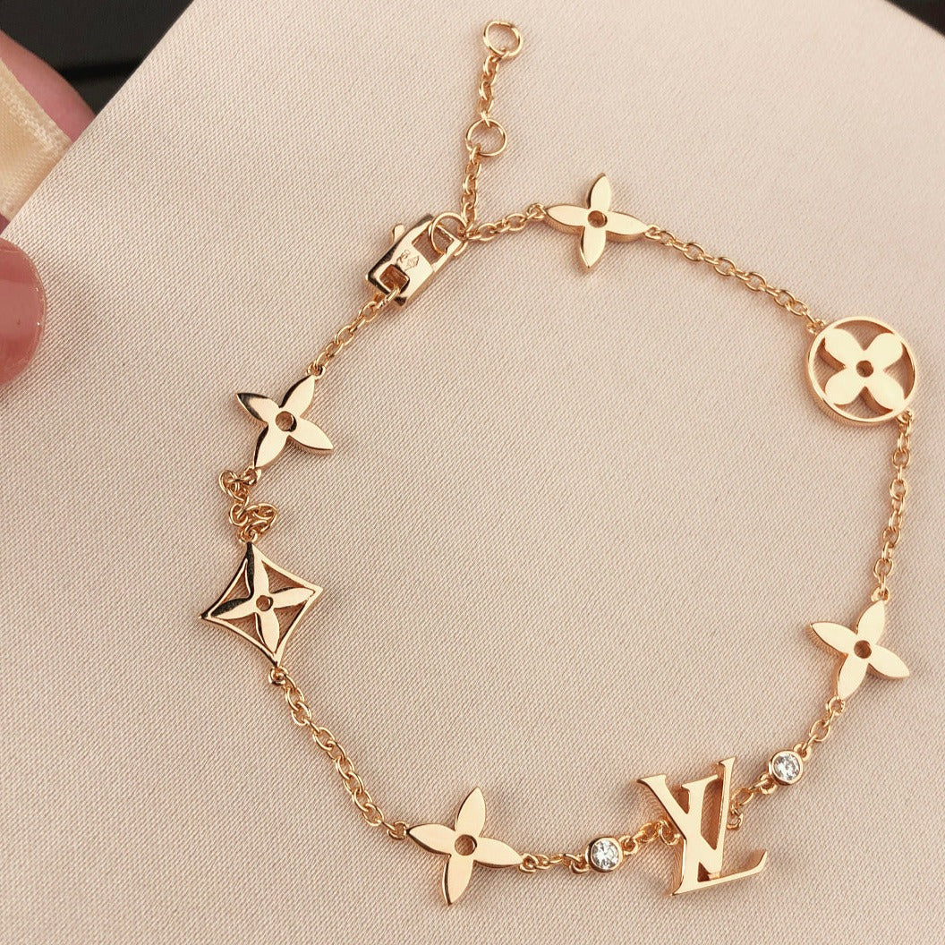 „Glow Jewelry“ STERNE UND SONNE 7 MOTIVE GOLDBRACELET