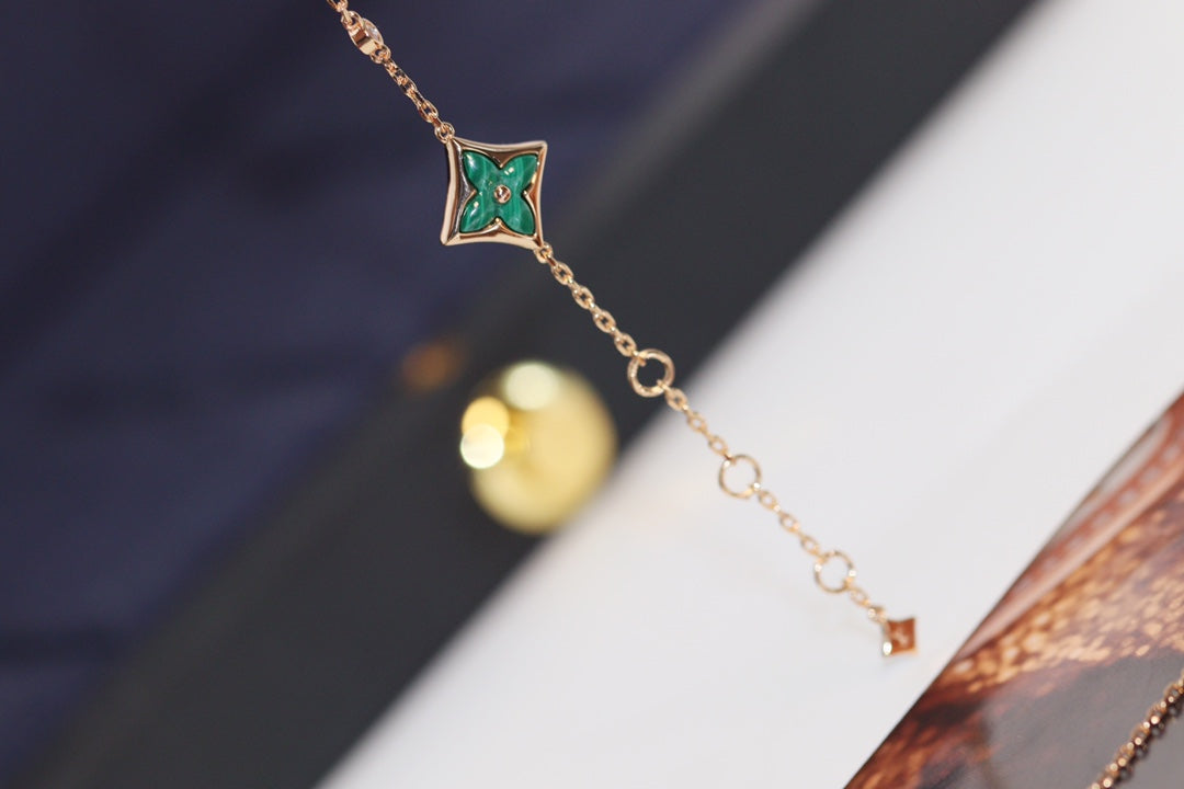 „Glow Jewelry“ Stern- und Sonnen-Armband mit 4 Motiven aus Rotgold und Malachit